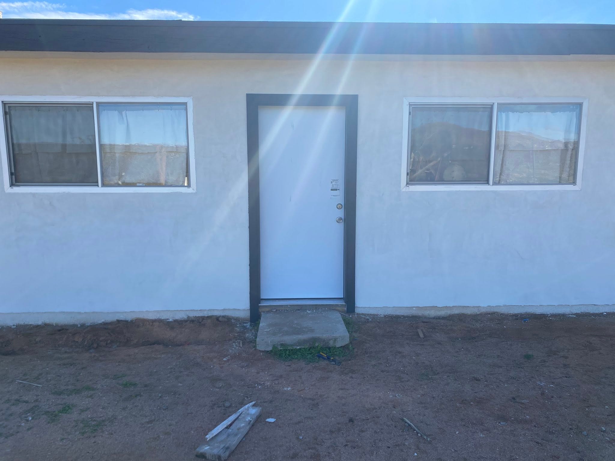 Exterior paint refresh with updated trim and entry door
