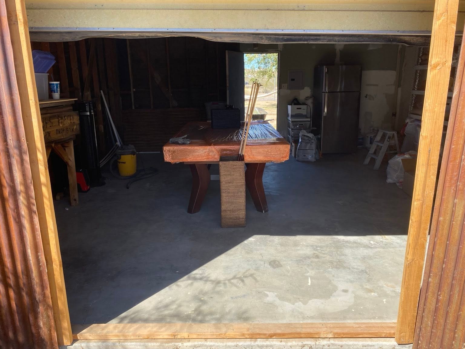 Garage conversion entry with wood and corrugated metal finish